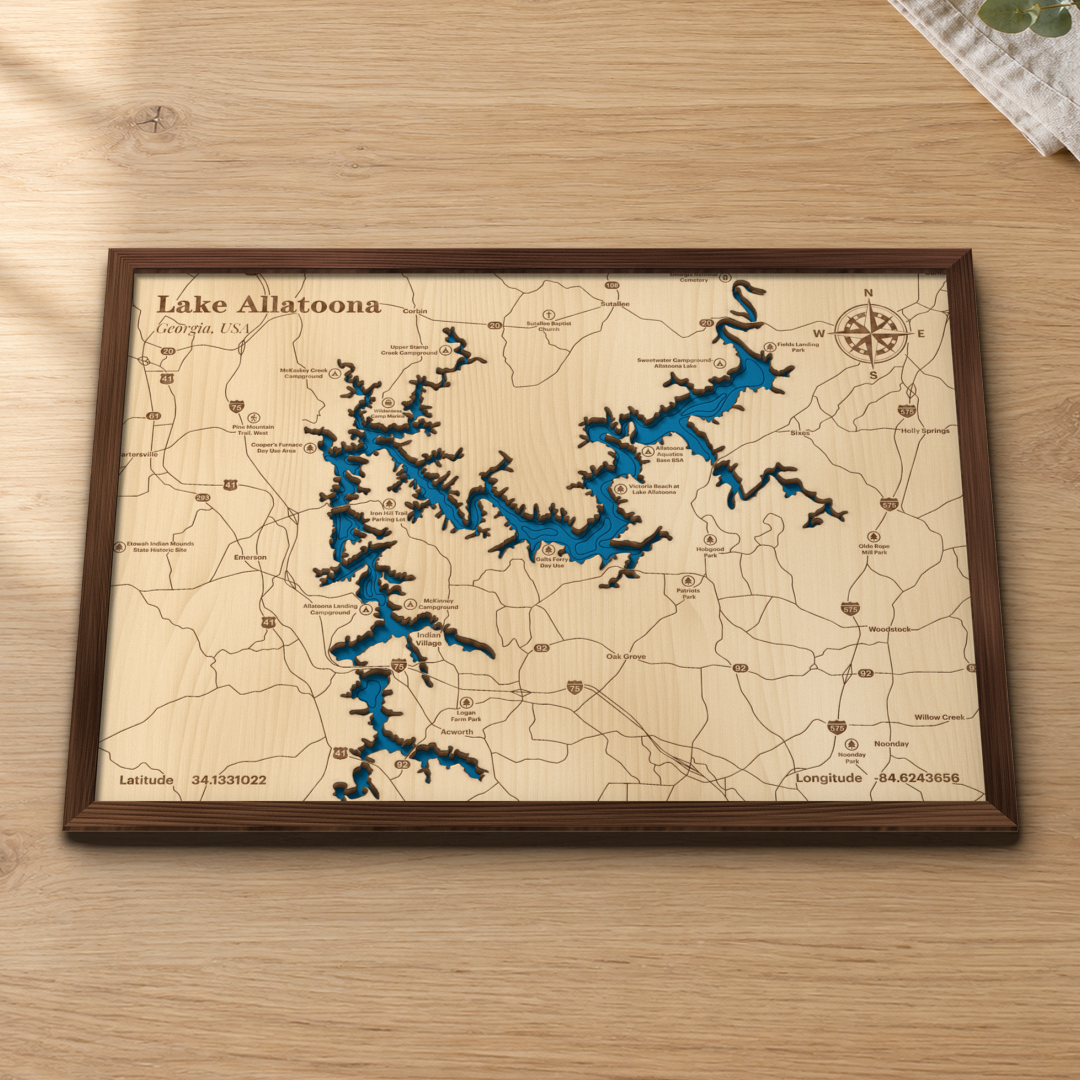 Lake Allatoona wood map lying flat on a wooden tabletop, showing the reservoir's depth contours with Acworth, Woodstock, Cartersville and the campgrounds around the shore engraved in