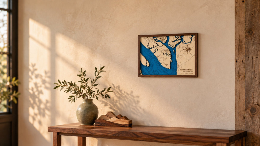 Layered wooden map of Parris Island, SC in a walnut frame hanging above a rustic console table