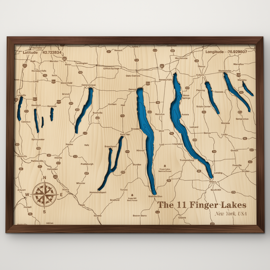 The 11 Finger Lakes layered wood map in a stained walnut frame, showing all eleven lakes in hand-painted blue across engraved maple