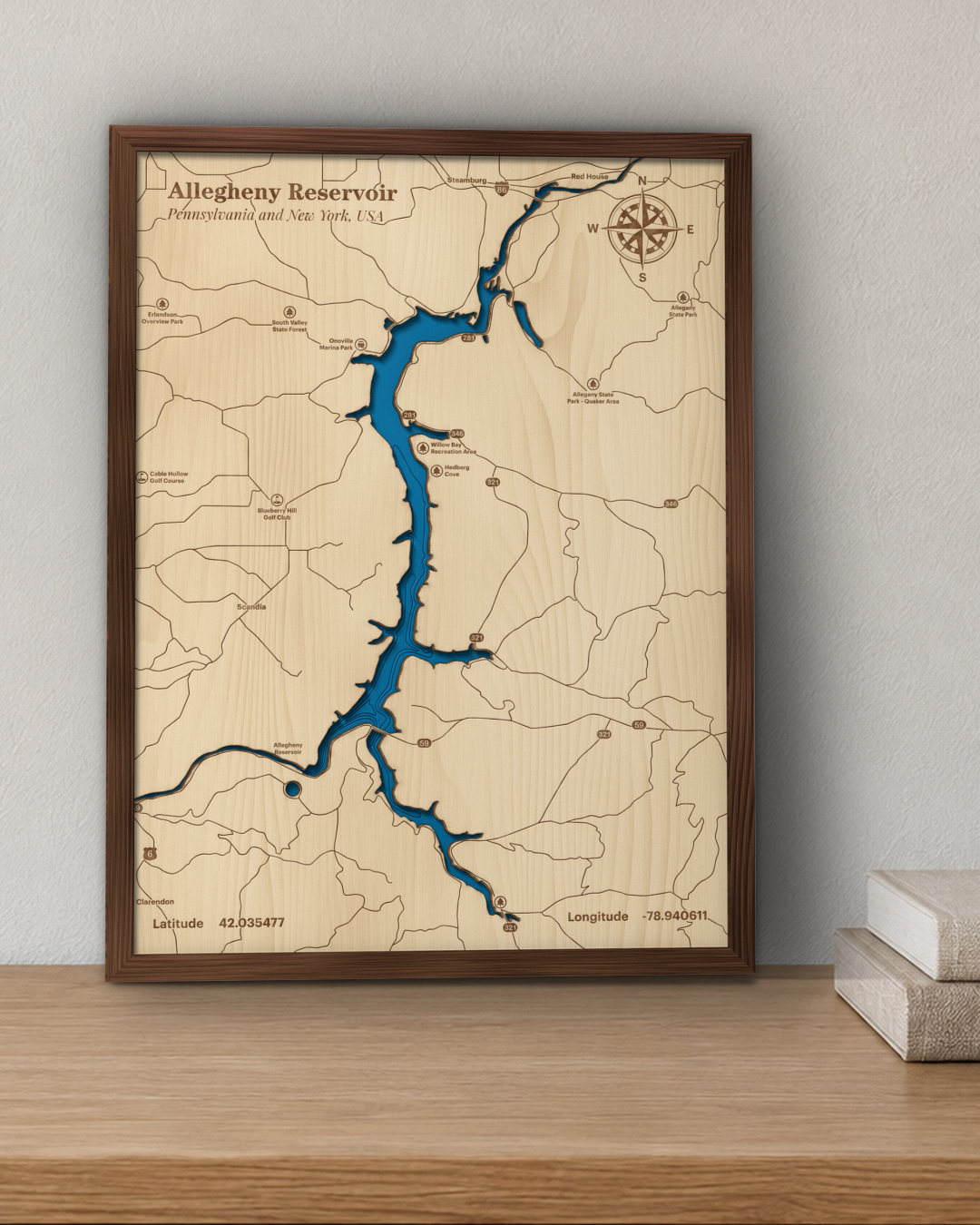 Allegheny Reservoir wood map in a walnut frame standing on a wooden sideboard against a wall for scale