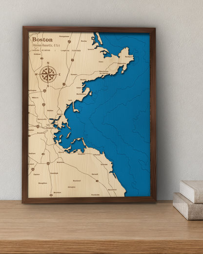 Boston wood map in a walnut frame hanging on a wall for scale
