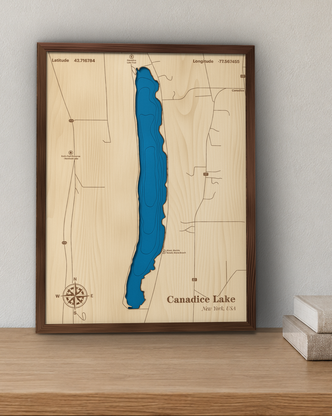 Canadice Lake wood map in a walnut frame hanging on a wall for scale