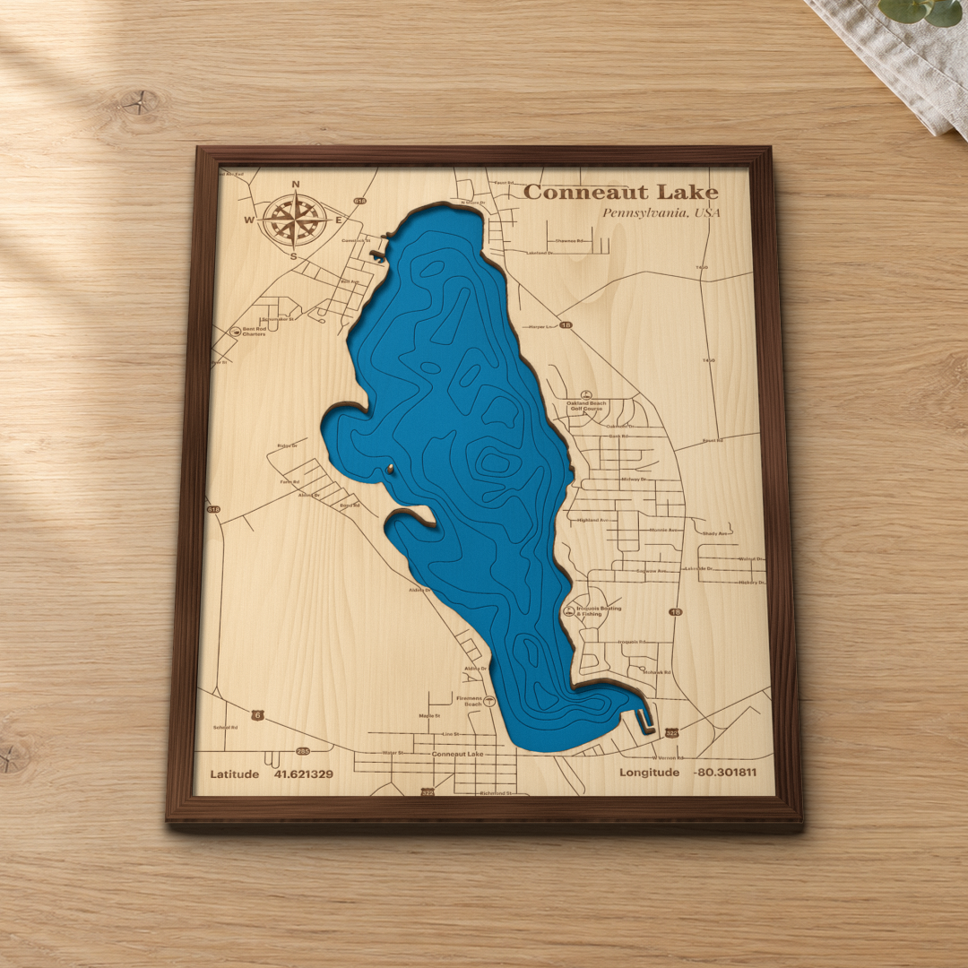Conneaut Lake wood map lying flat on a wooden tabletop, showing the depth contours engraved in