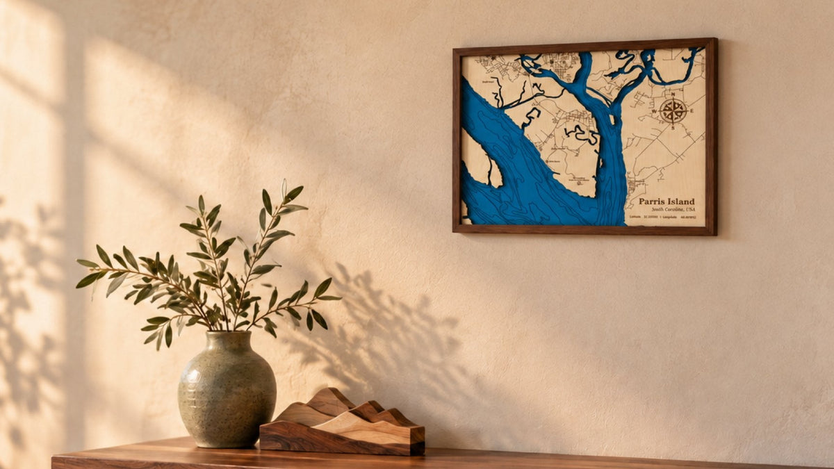 Handmade layered wooden lake map hanging above a rustic console table