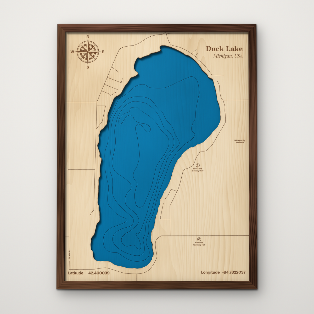 Duck Lake, Michigan, layered wood map with blue painted water and stained walnut frame, by Dirt Road Barns