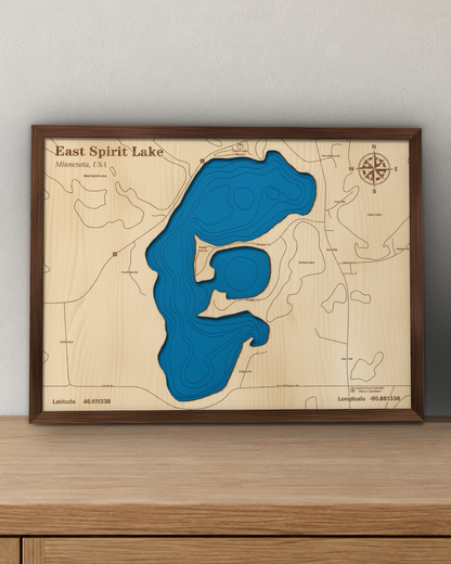 East Spirit Lake wood map in a walnut frame standing on a wooden sideboard against a wall for scale