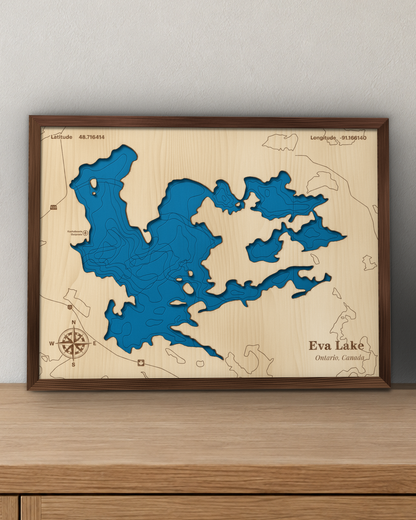 Eva Lake wood map in a walnut frame standing on a wooden sideboard against a wall for scale