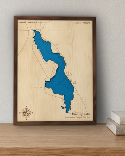 Findley Lake wood map in a walnut frame standing on a wooden sideboard against a wall for scale