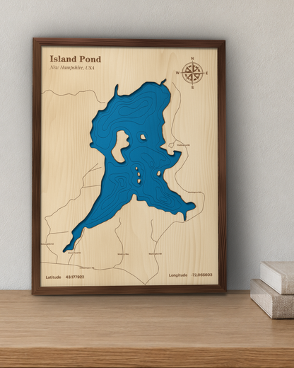 Island Pond wood map in a walnut frame standing on a wooden sideboard against a wall for scale
