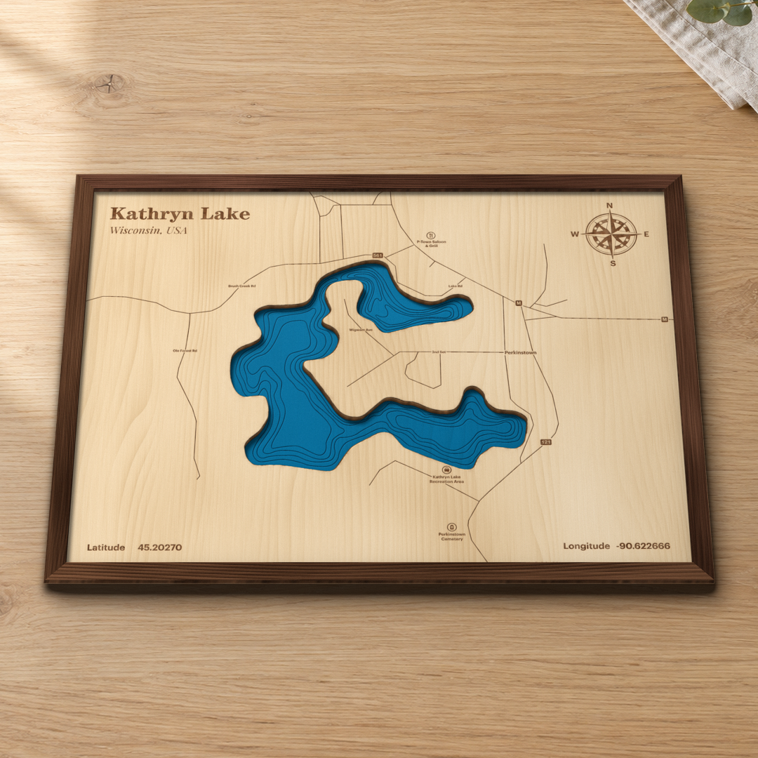 Kathryn Lake wood map lying flat on a wooden tabletop, showing the depth contours engraved in