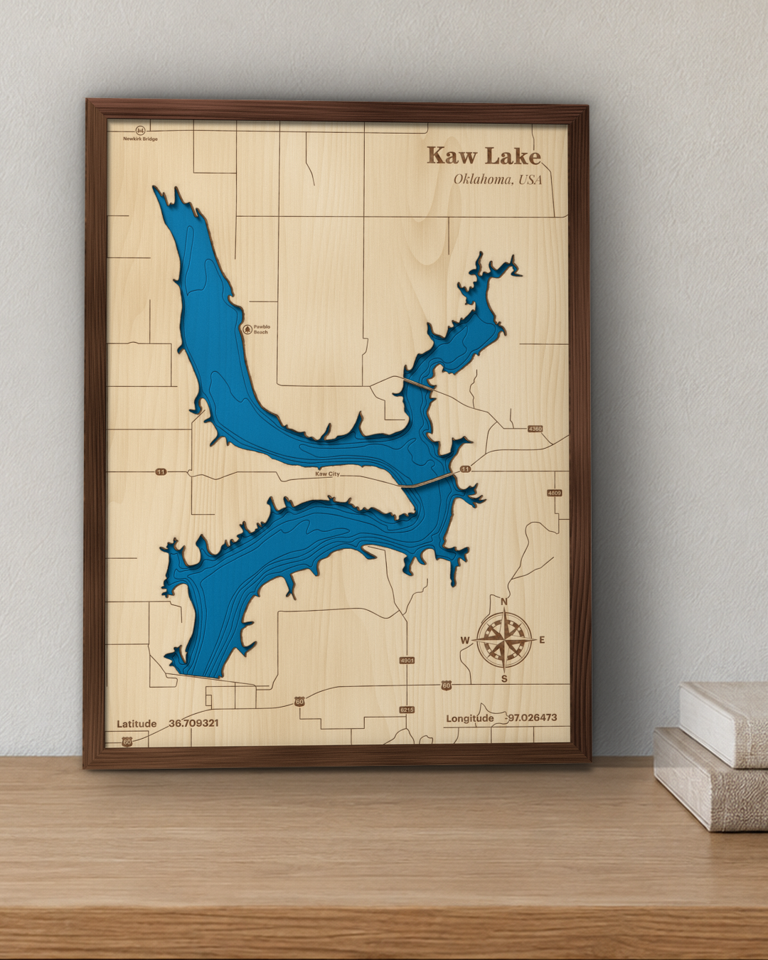 Kaw Lake wood map in a walnut frame standing on a wooden sideboard against a wall for scale