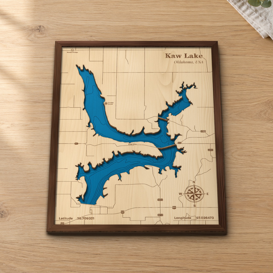 Kaw Lake wood map lying flat on a wooden tabletop, showing the depth contours engraved in