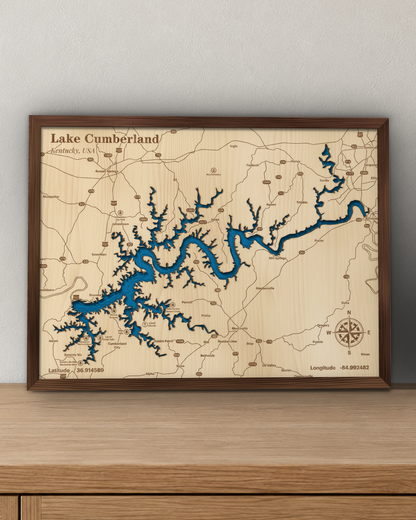 Lake Cumberland wood map in a walnut frame standing on a wooden sideboard against a wall for scale