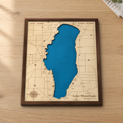 Lake Winnebago wood map lying flat on a wooden tabletop, showing the depth contours and the whole shoreline from Neenah to Fond du Lac engraved in