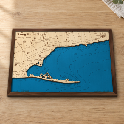 Long Point Bay wood map lying flat on a wooden tabletop, showing the depth contours, the Long Point spit and Turkey Point engraved in