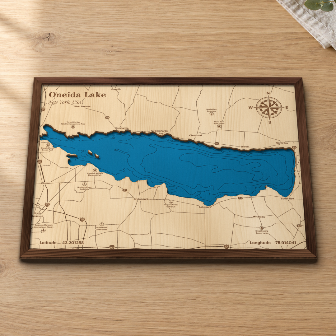 Oneida Lake wood map lying flat on a wooden tabletop, showing Constantia, Bridgeport, Cicero and the lake's depth contours