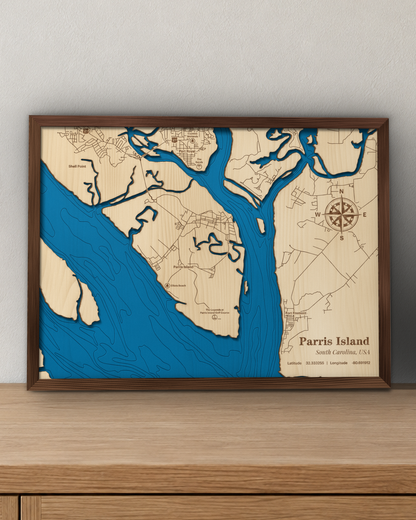 Parris Island wood map in a walnut frame standing on a wooden sideboard against a wall for scale