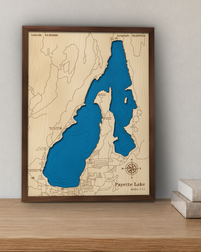 Payette Lake wood map in a walnut frame standing on a wooden sideboard against a wall for scale
