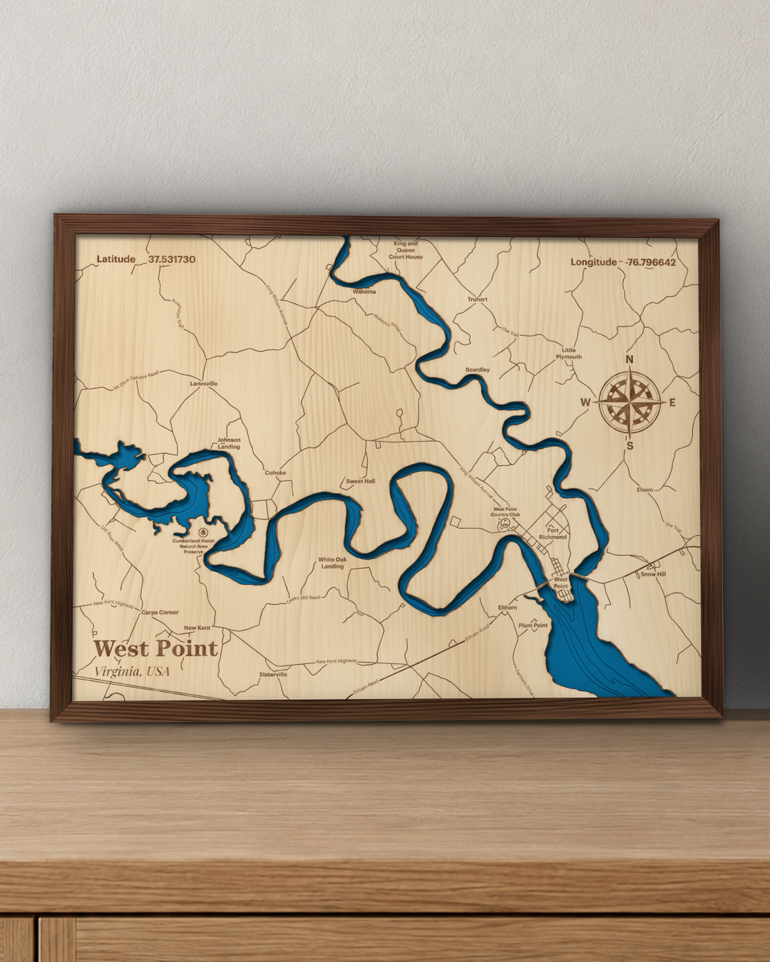 West Point wood map in a walnut frame standing on a wooden sideboard against a wall for scale